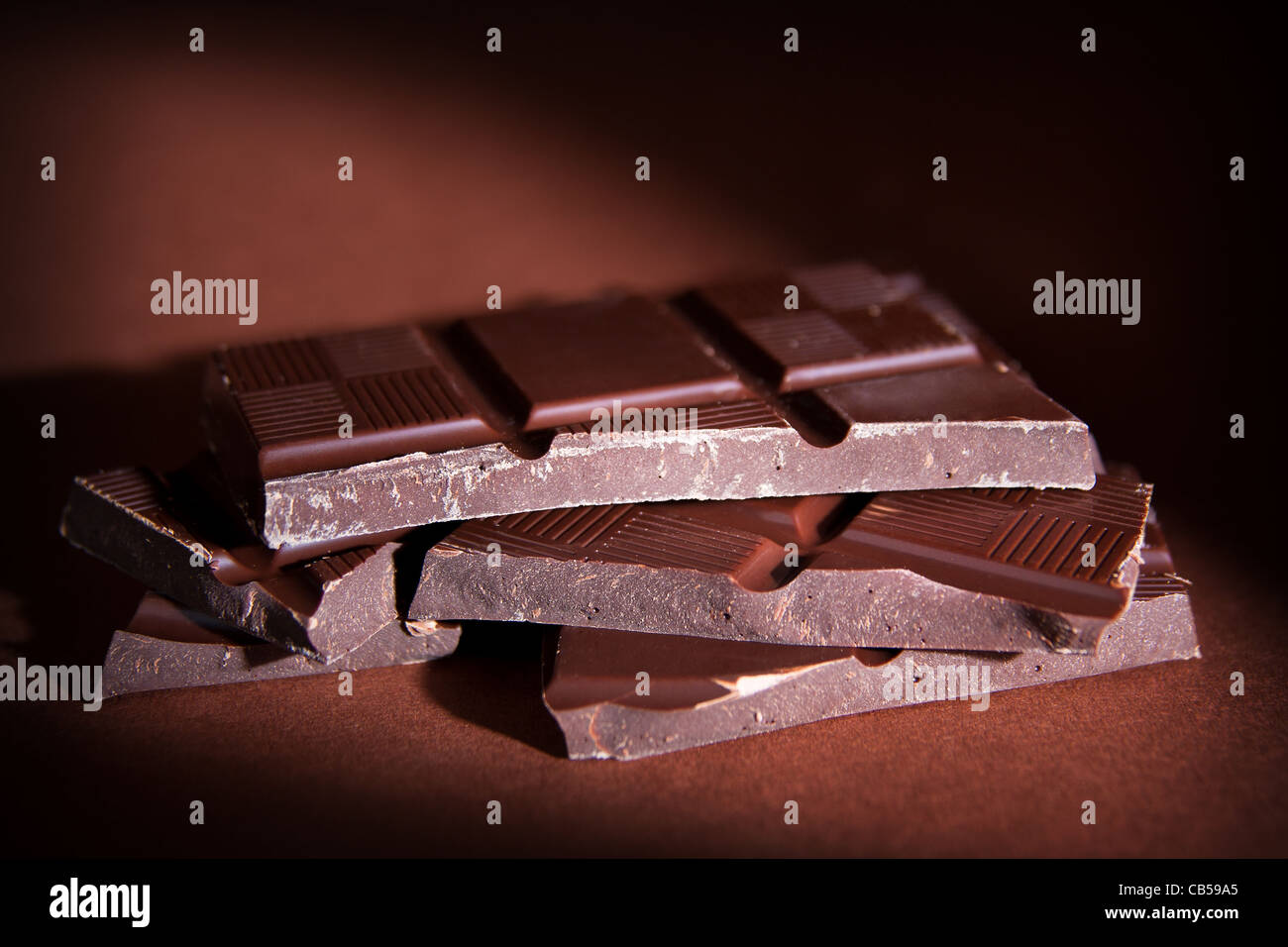Chocolate bars on brown background Stock Photo