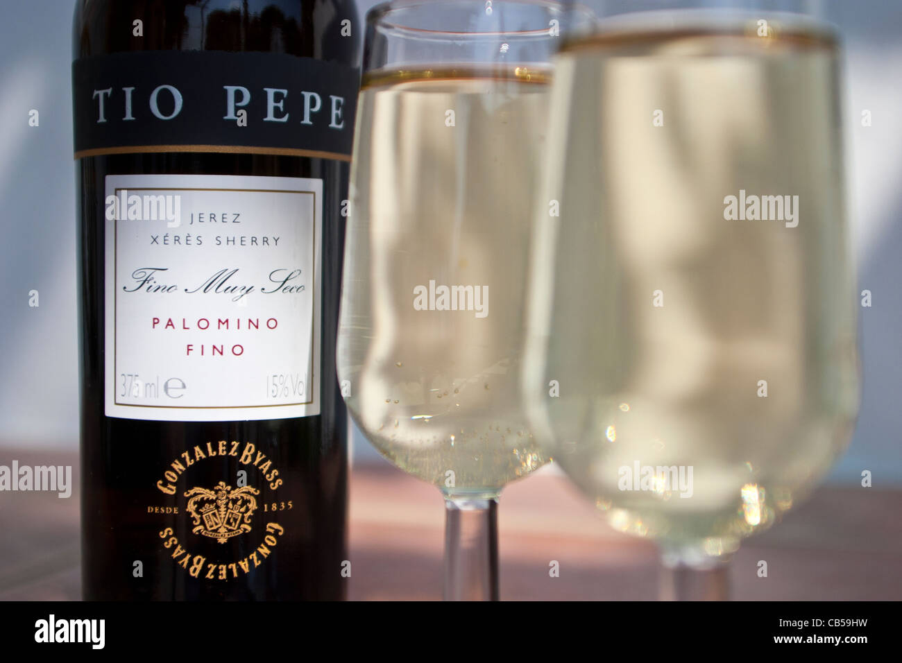 Tio Pepe sherry bottle and sherry glasses Stock Photo - Alamy