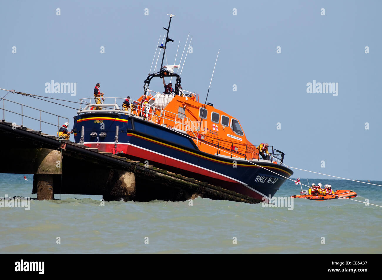 The Cromer offshore Lifeboat - The Tamar class RNLB Victor Freeman being winched back up the ramp and in to the boat house Stock Photo