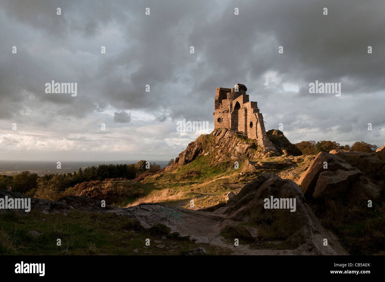 The folly of Mow Cop on the Staffordshire, Cheshire border under a brooding September sky. Stock Photo