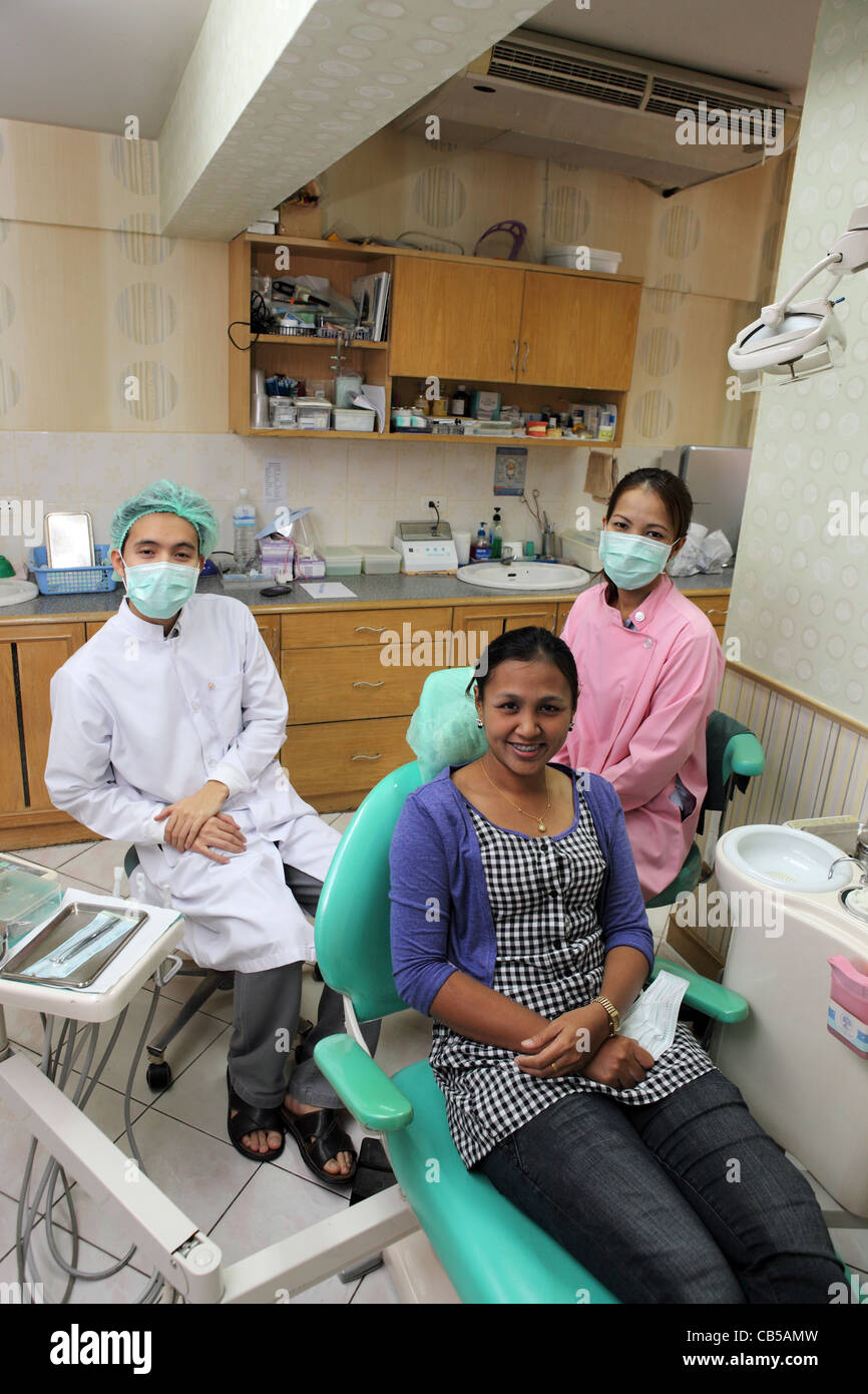 Dentist and nurses at dental surgery. Phuket Town, Phuket Island