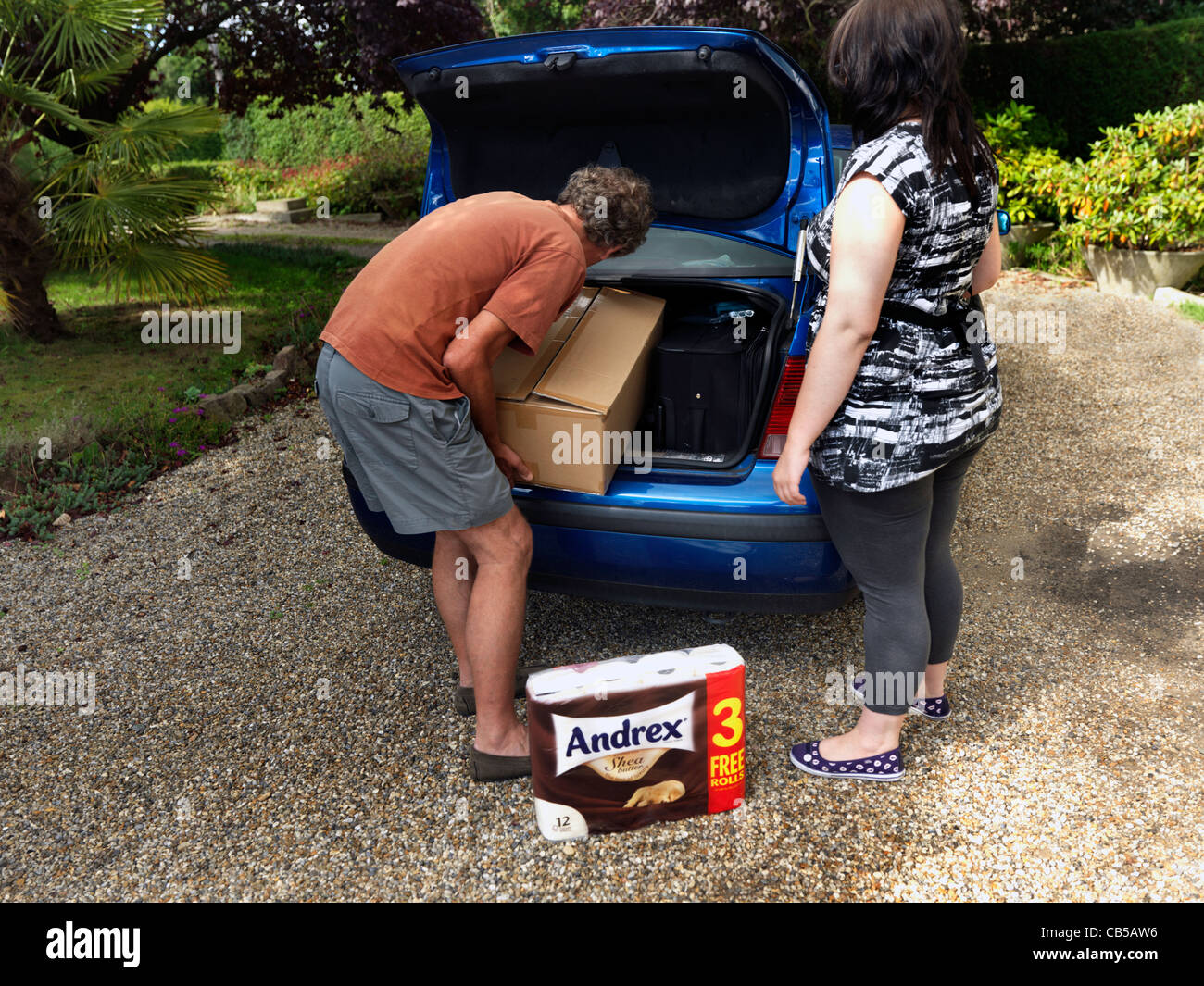 Father Helping Teenager Loading Car Boot Ready For First Year at University Surrey England Stock Photo
