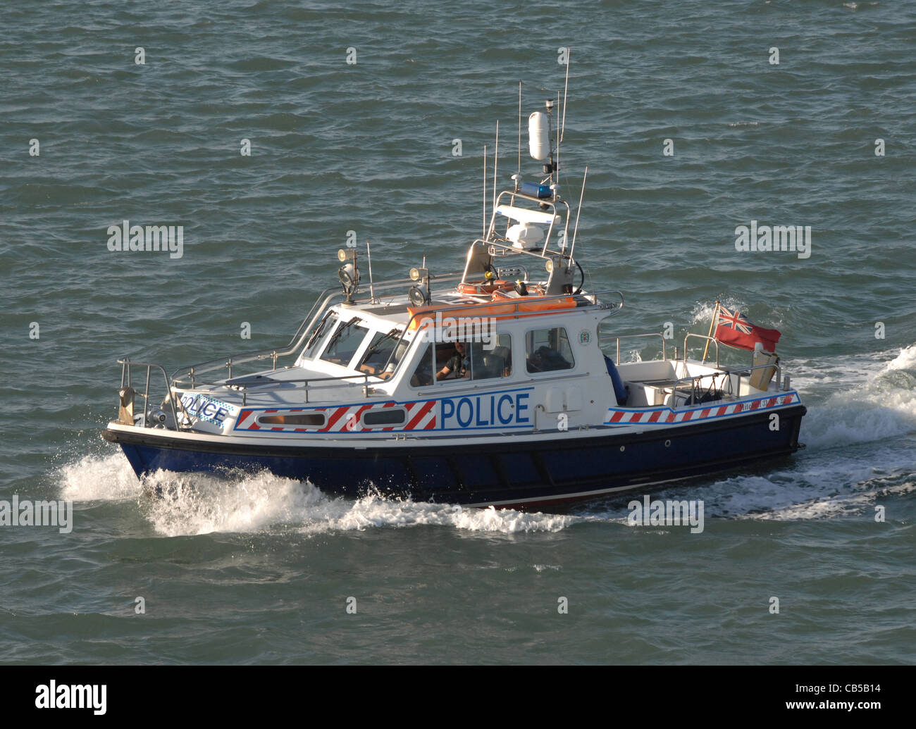 A police launch on maritime patrol duties protecting ports and harbors. Stock Photo