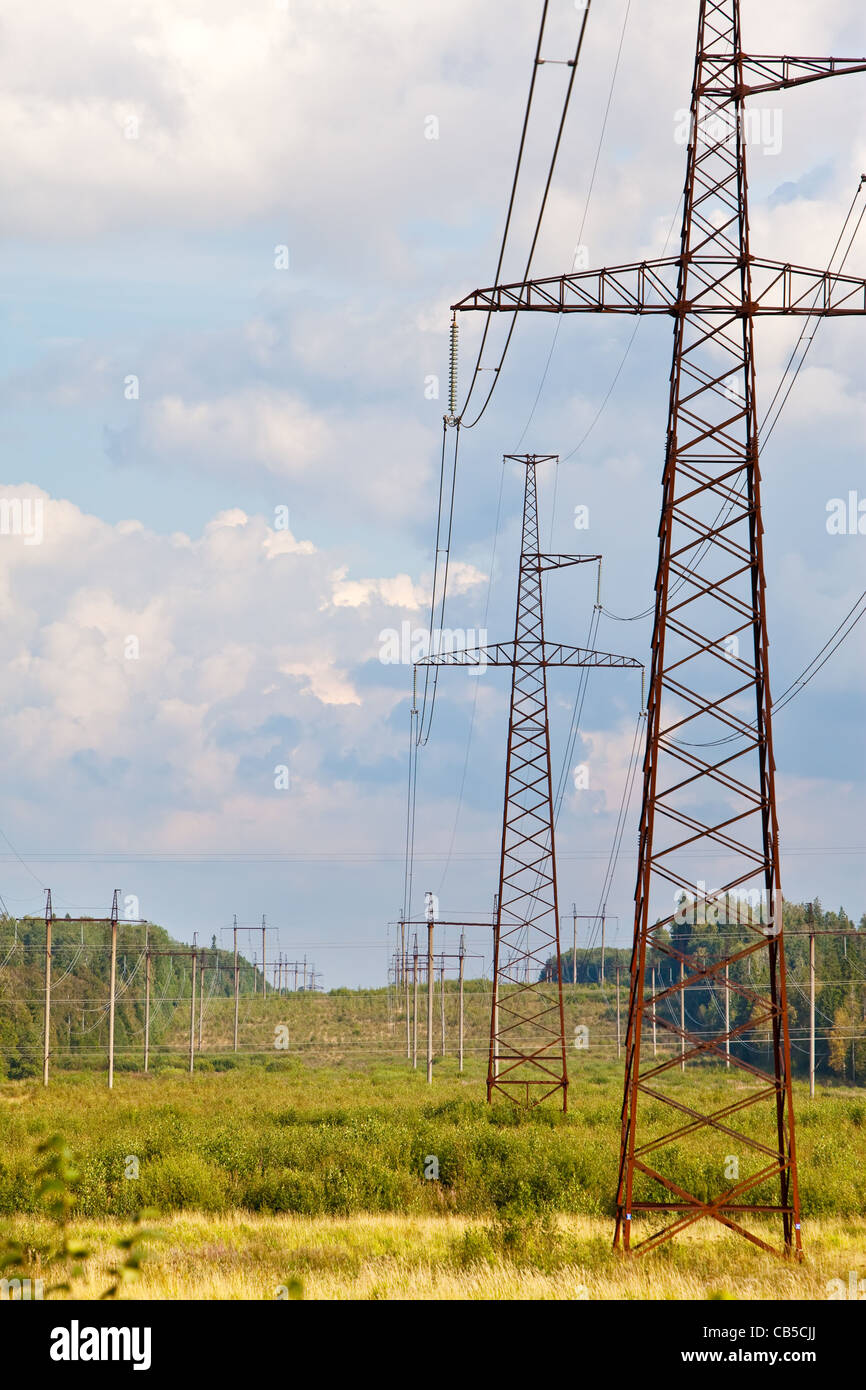Highvoltage line of electricity transmissions on field Stock Photo Alamy