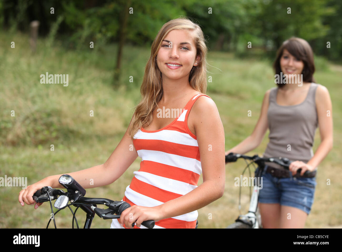 Girls riding bikes school hi-res stock photography and images - Alamy
