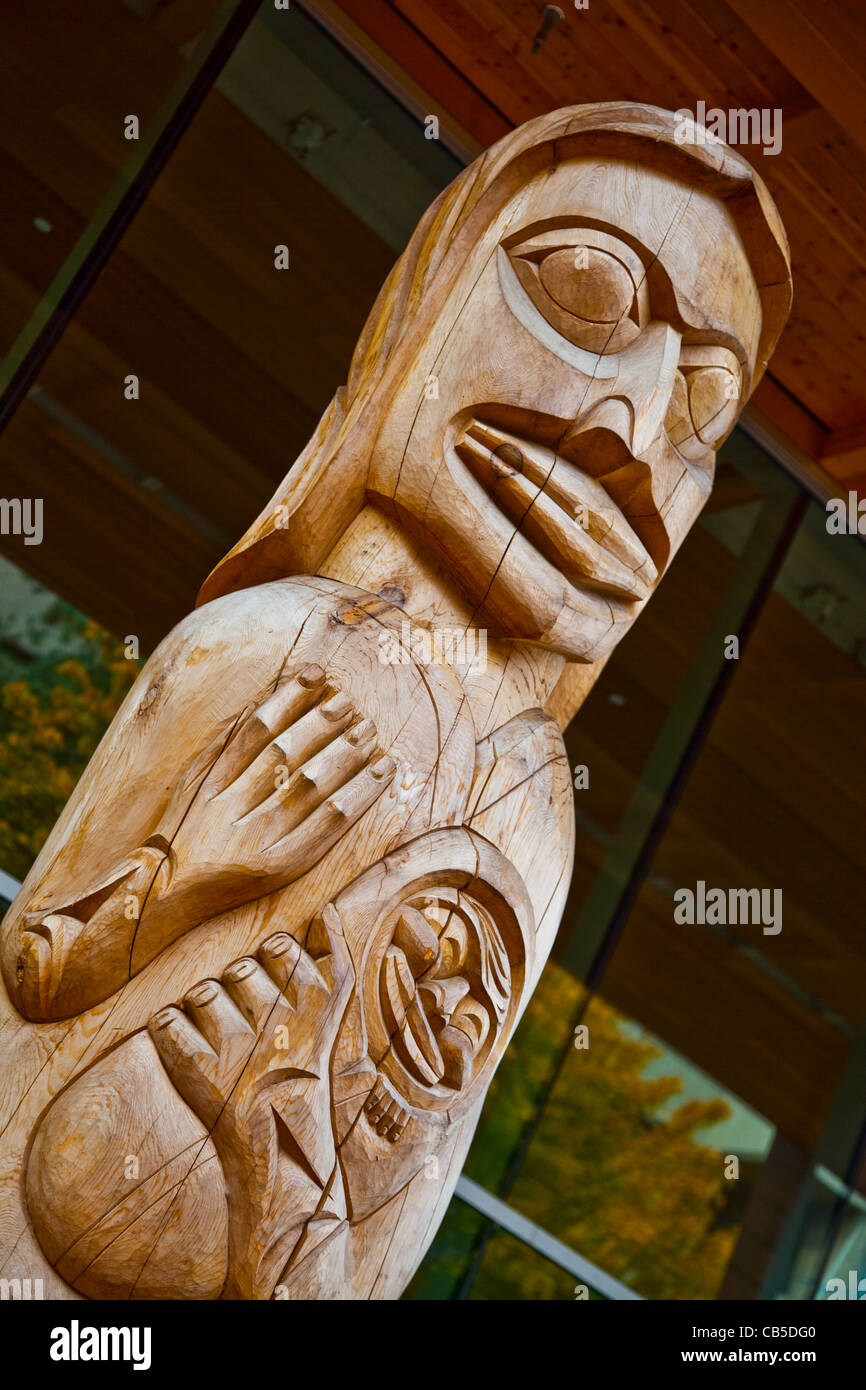 Upper section of an unpainted totem pole in Victoria, Canada Stock Photo