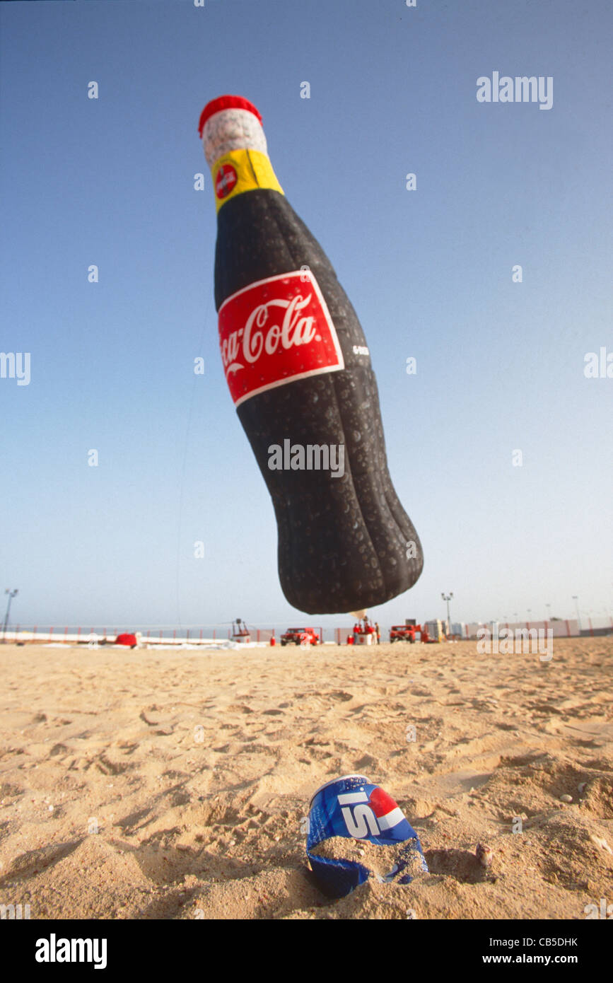 A Crushed Pepsi Can Lies In The Sand Near A Coca Cola Giant Hot Air Balloon Being Inflated Jeddah Stock Photo Alamy