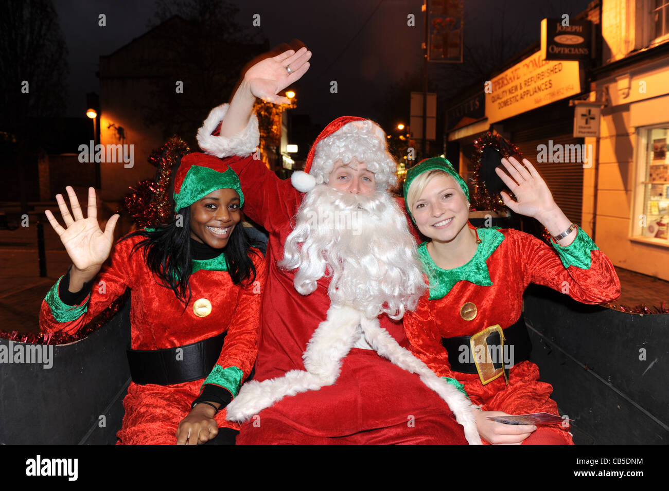 Santa Claus and his helpers Uk Stock Photo
