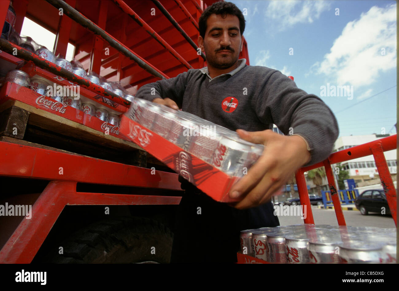 Truck driver coca cola truck delivering hires stock photography and
