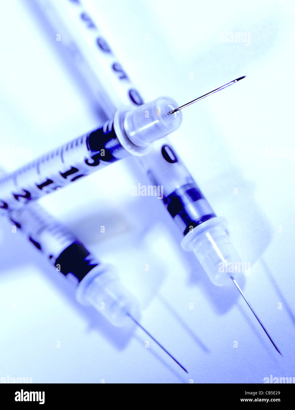 Three syringes on a white background. Still life. Stock Photo