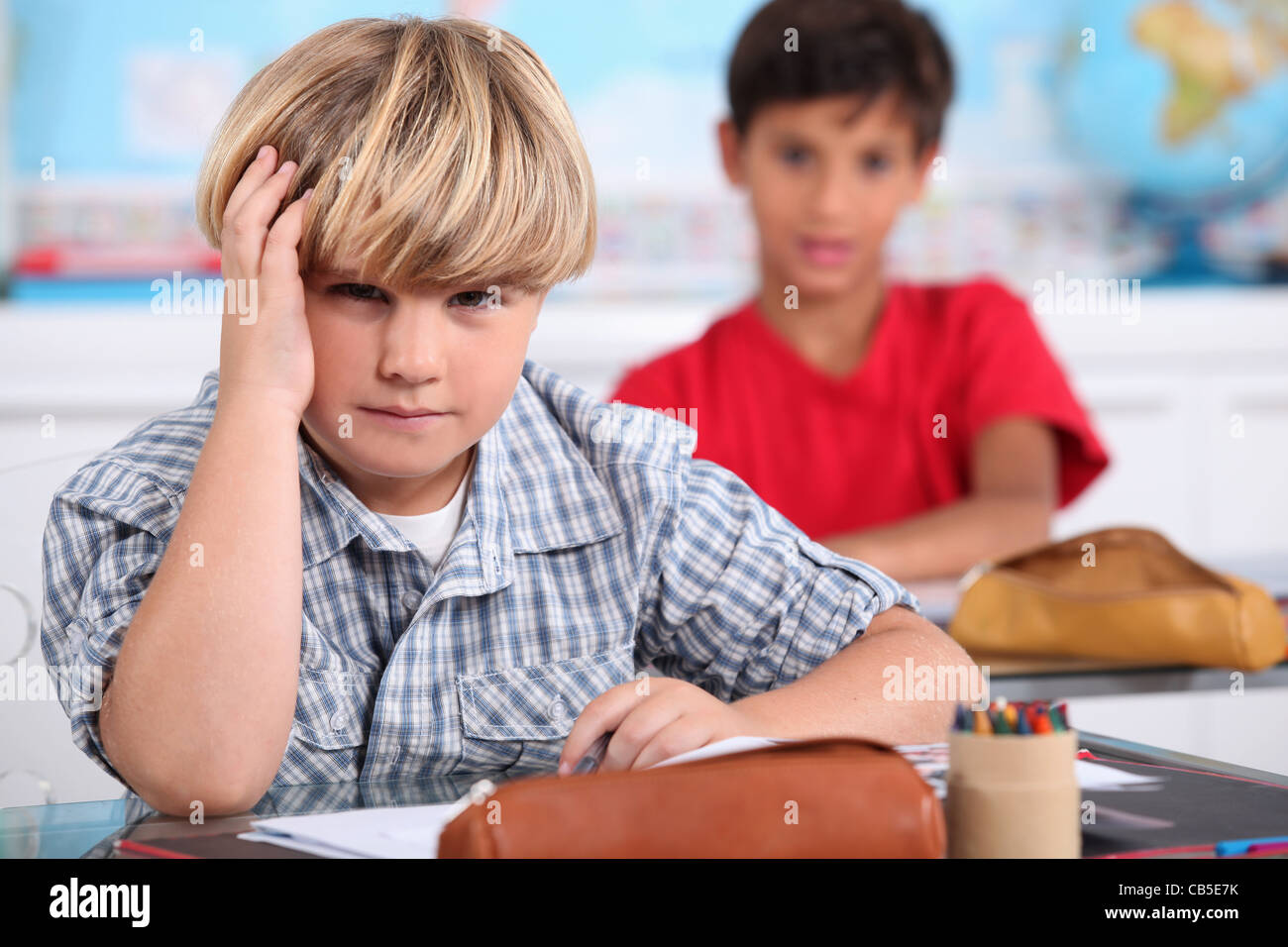 Two kids in classroom Stock Photo - Alamy