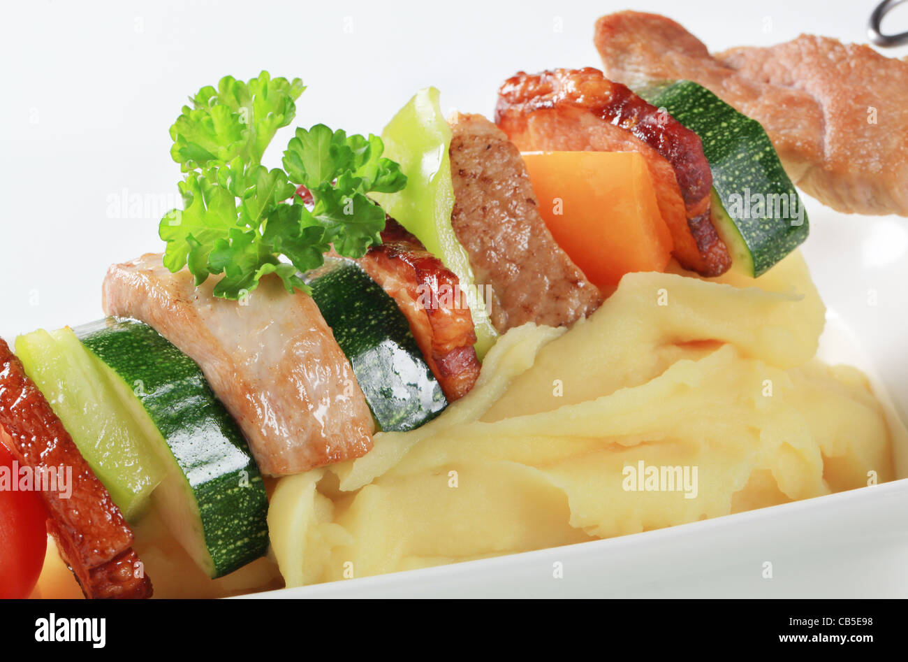 Pork and vegetable skewer with mashed potato Stock Photo