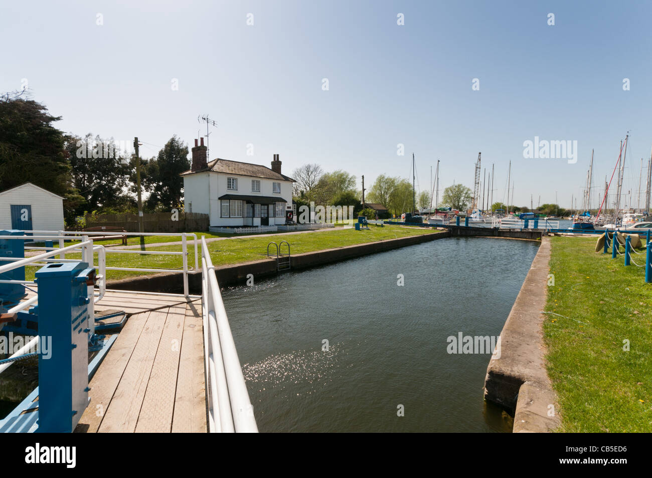 The lock at Heybridge Basin, Essex with the lock keepers cottage in the background. Stock Photo