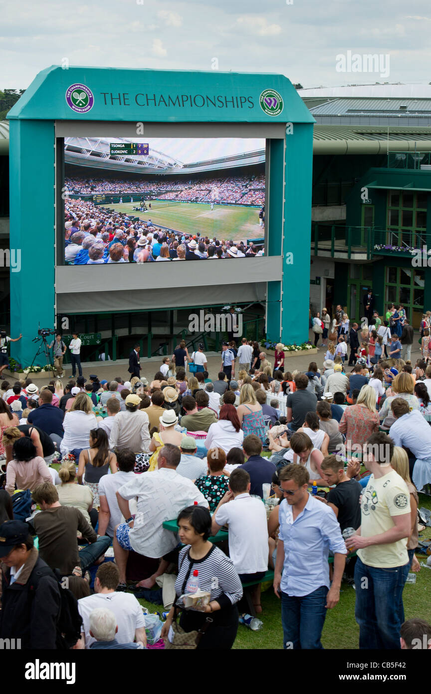 Fans on Henman Hill / Murray Mount watch the Djokovic v Tsonga match Novak. The Wimbledon Tennis Championships. Stock Photo
