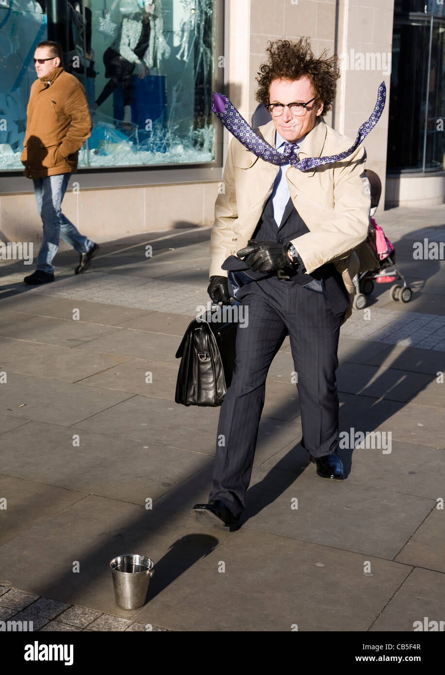 Man in a Hurry" Stationary Artist - Motionless on the City Streets, with  Briefcase and elevated stiffened Tie, Manchester UK Stock Photo - Alamy