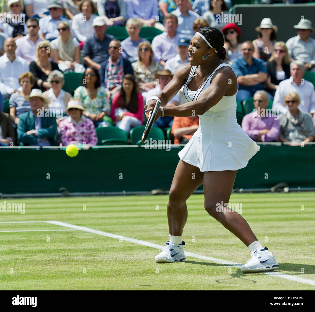 23.06.2011. Serena Williams USA (7) defeats Simona Halep ROU 36,62,61. Serena in action. The Wimbledon Tennis Championships. Stock Photo