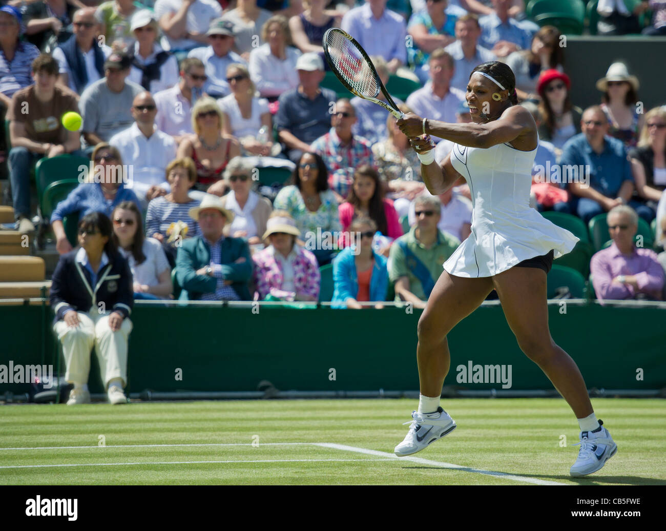 23.06.2011. Serena Williams USA (7) defeats Simona Halep ROU 36,62,61. Serena in action. The Wimbledon Tennis Championships. Stock Photo