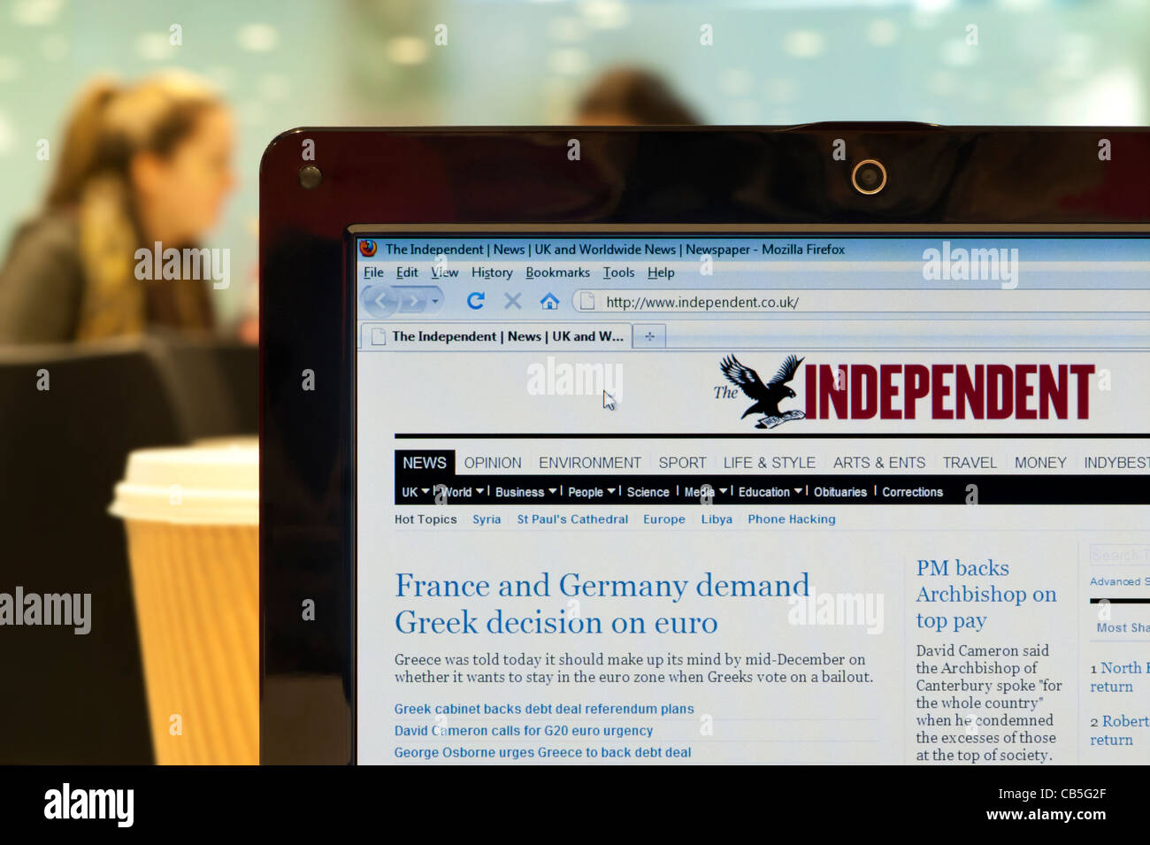 The Independent website shot in a coffee shop environment (Editorial use only: print, TV, e-book and editorial website). Stock Photo