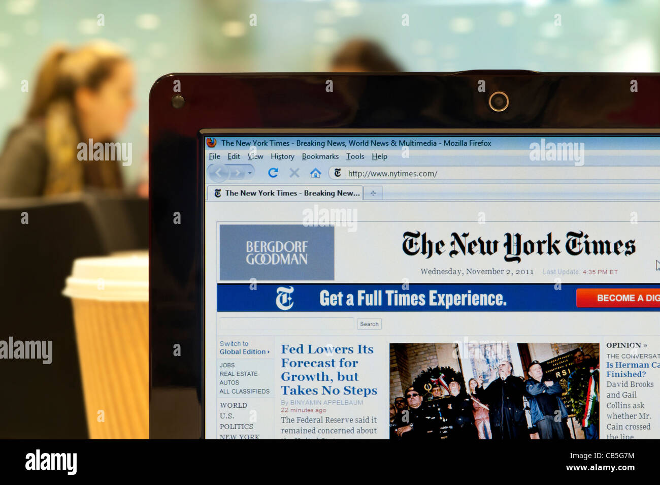 The New York Times website shot in a coffee shop environment (Editorial use only: print, TV, e-book and editorial website). Stock Photo
