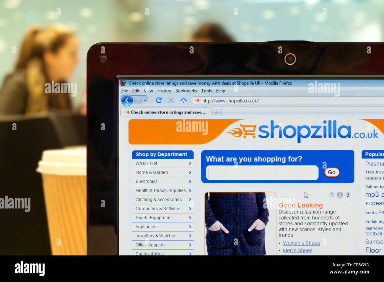 The Shopzilla website shot in a coffee shop environment (Editorial use only: print, TV, e-book and editorial website). Stock Photo