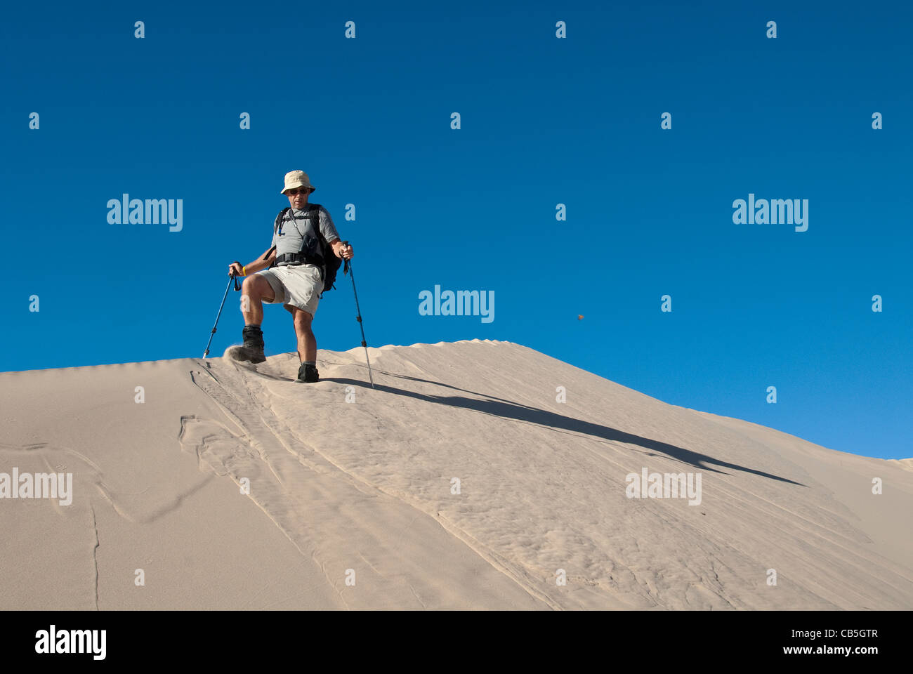 Mike Vining making the Kelso Dunes sing butterfly too Mojave National Preserve California USA Stock Photo