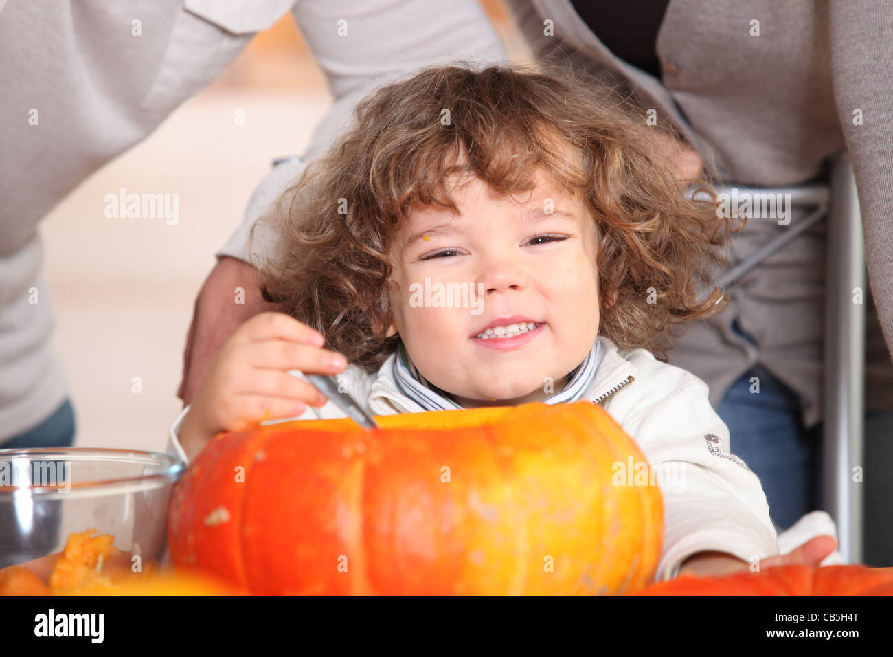 A plump kid carving a pumpkin Stock Photo Alamy