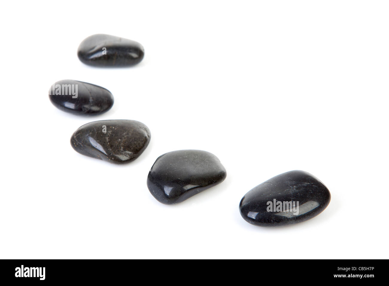 Black stepping stones in a row over white background Stock Photo