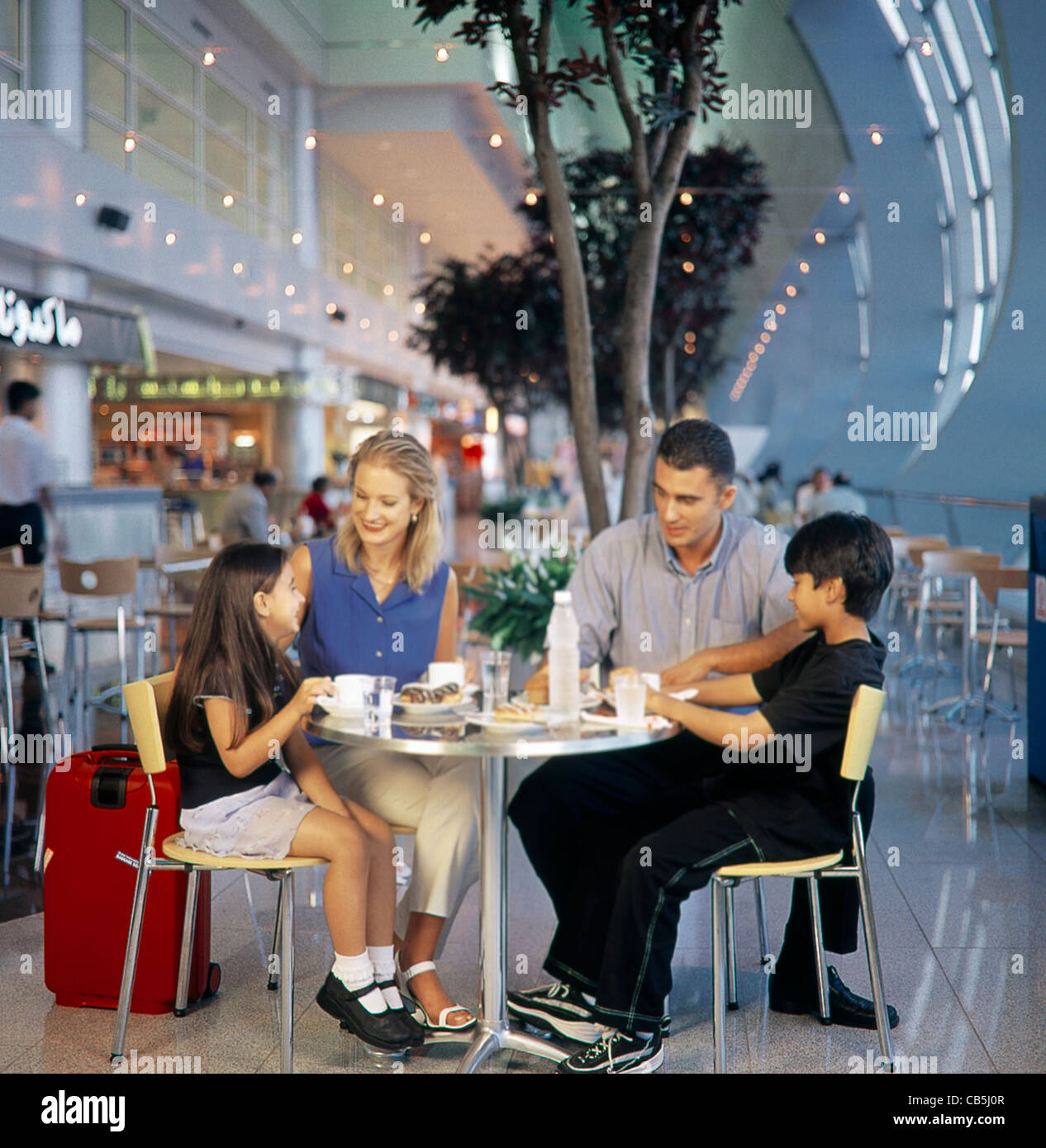 Dubai Airport UAE Sheikh Rashid Terminal Food Court Family Eating Stock Photo