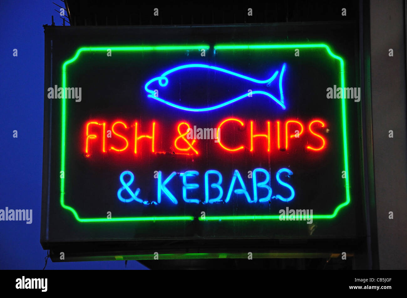 'Fish & Chips & Kebabs' neon sign at dusk, Oxford Street, City of Westminster, London, Greater London, England, United Kingdom Stock Photo