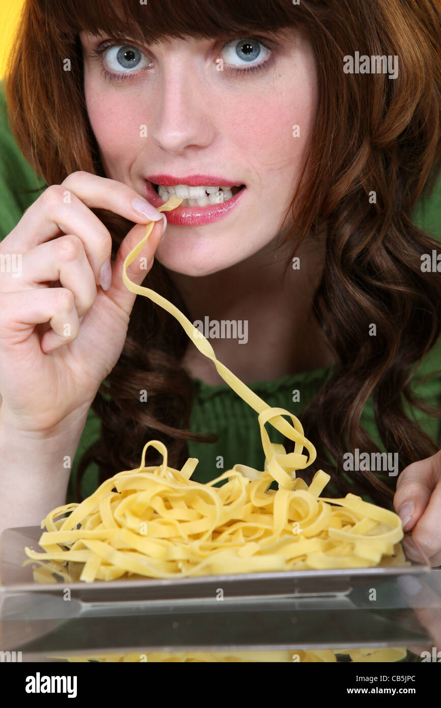 woman eating pasta Stock Photo Alamy