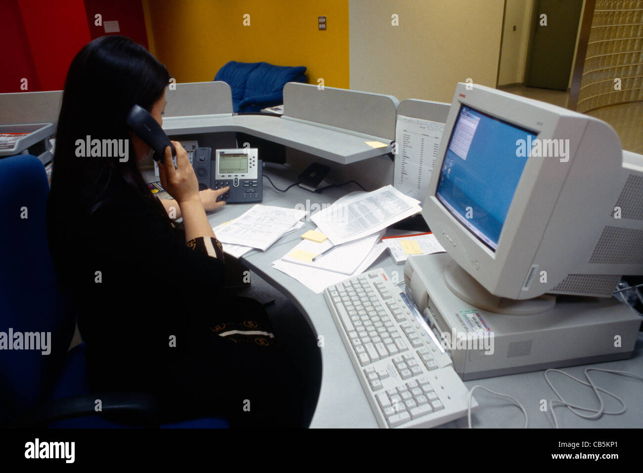 Dubai UAE Media City Asian Woman On Telephone At Her Desk Stock Photo