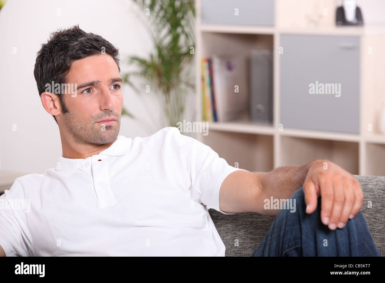 man resting on his sofa Stock Photo - Alamy