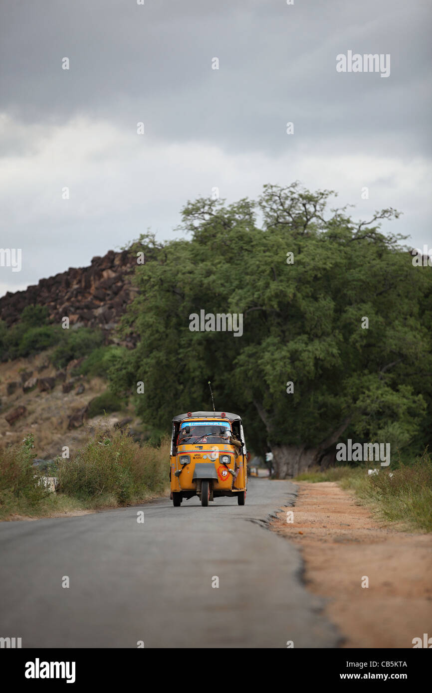 Auto rickshaw moving on the road, Chennai, Tamil Nadu, India Stock