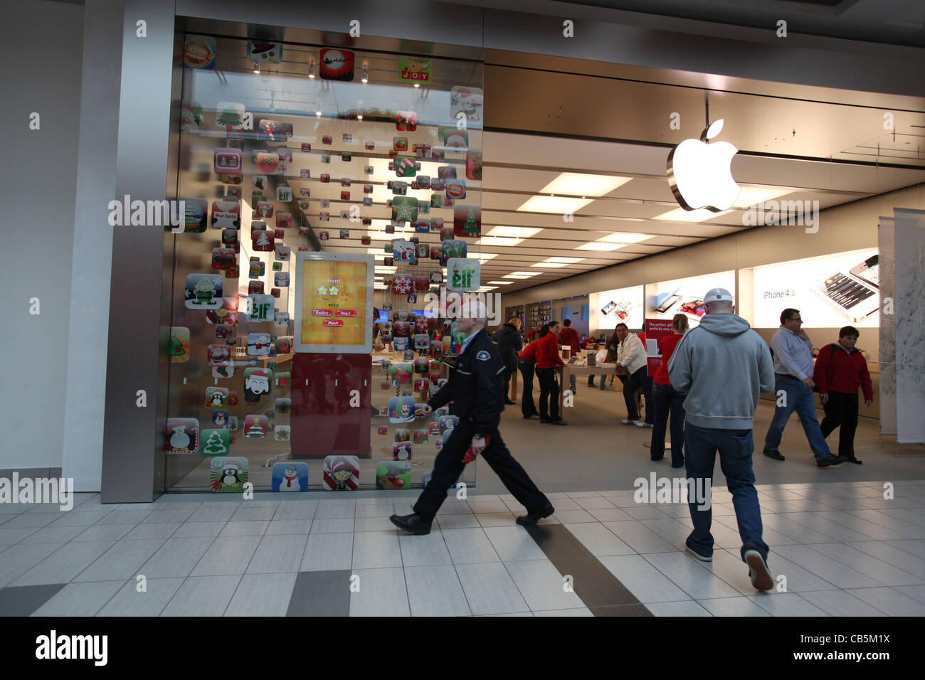 Shoppers Walking In And Out Of A Newly Opened Apple Store In Stock