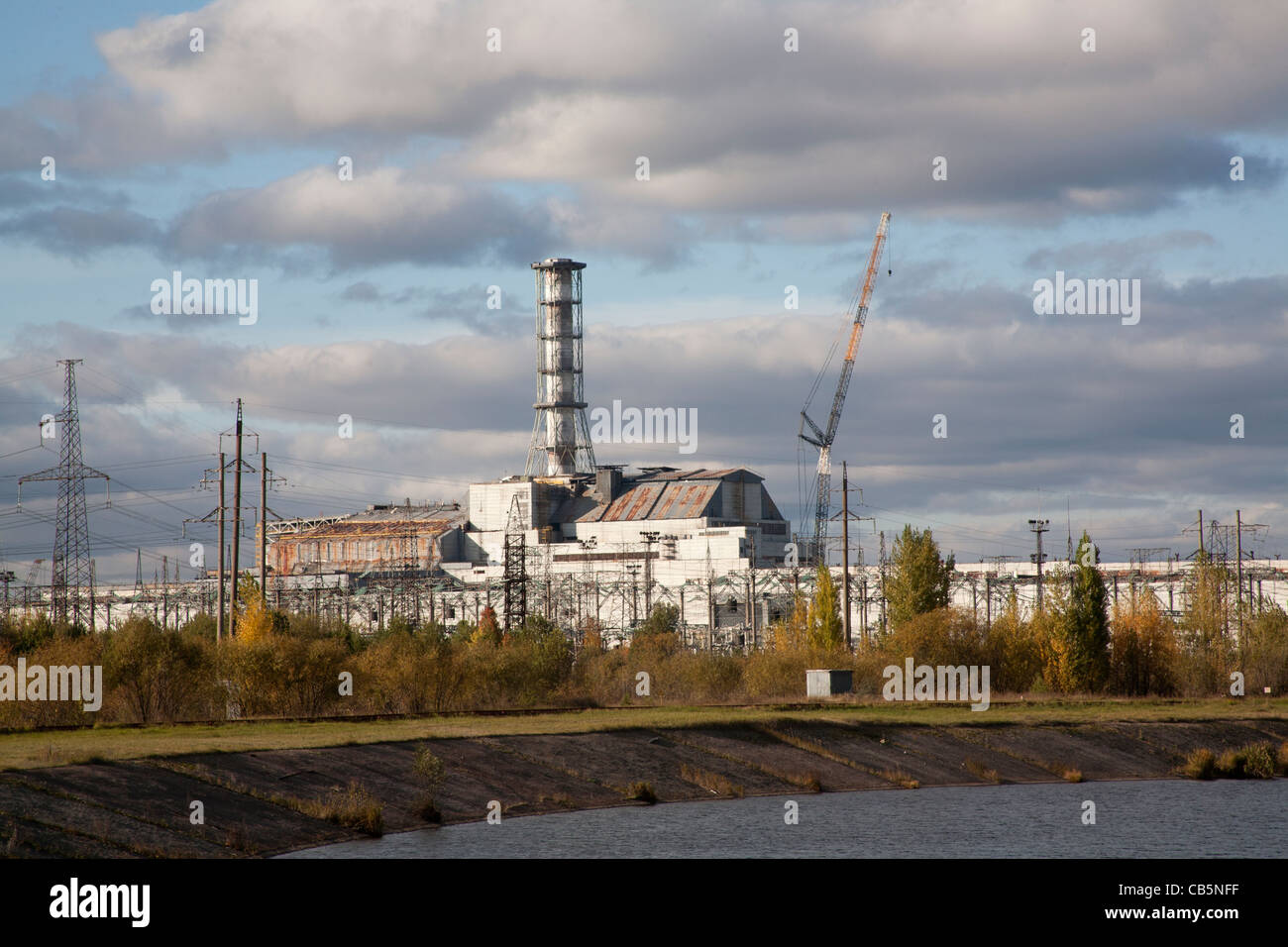 The Pripyat River or Prypiat River with the Chernobyl nuclear power plant in the background Chernobyl Ukraine Stock Photo