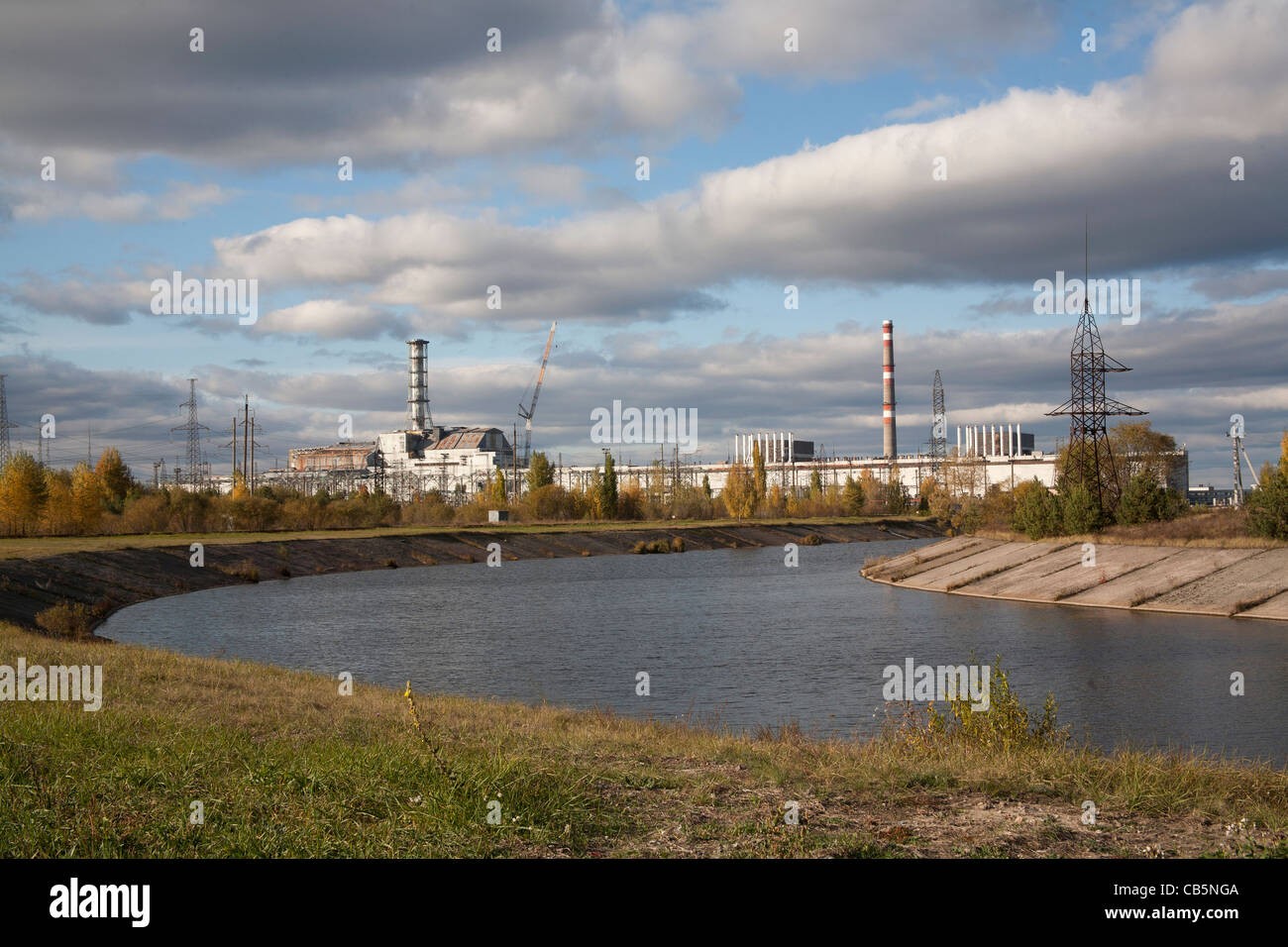 The Pripyat River or Prypiat River with the Chernobyl nuclear power plant in the background Chernobyl Ukraine Stock Photo