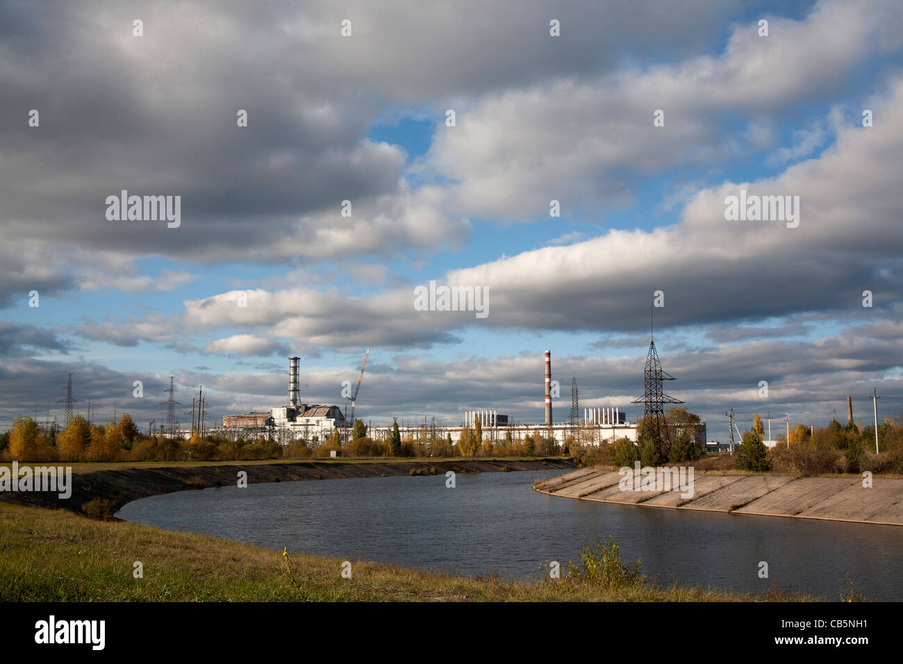 The Pripyat River or Prypiat River with the Chernobyl nuclear power plant in the background Chernobyl Ukraine Stock Photo