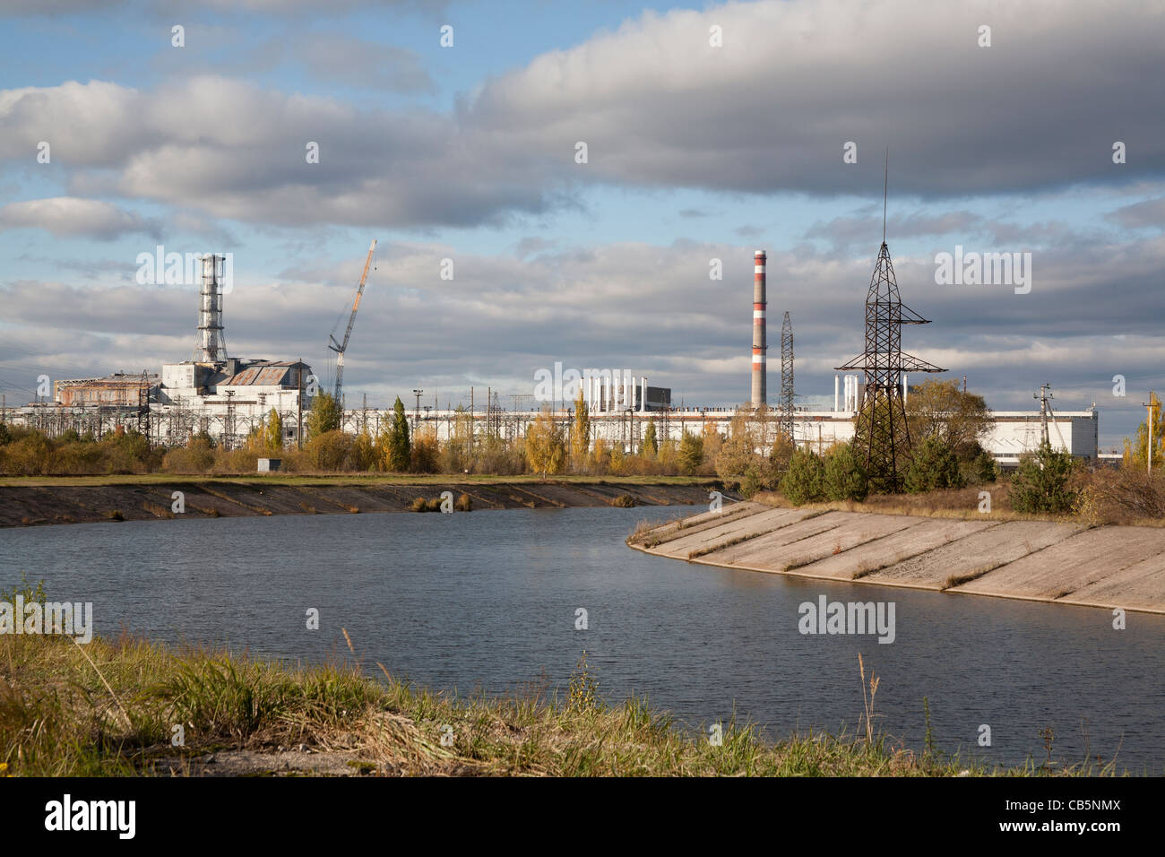 The Pripyat River or Prypiat River with the Chernobyl nuclear power plant in the background Chernobyl Ukraine Stock Photo