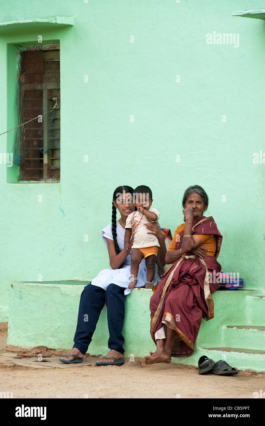 Rural Indian village family sitting outside their house. Andhra Pradesh, India Stock Photo