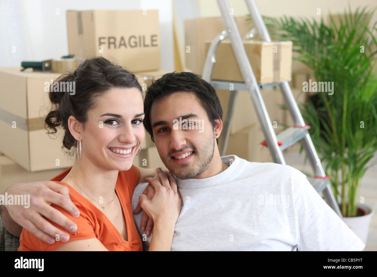 Young couple moving into first home Stock Photo - Alamy