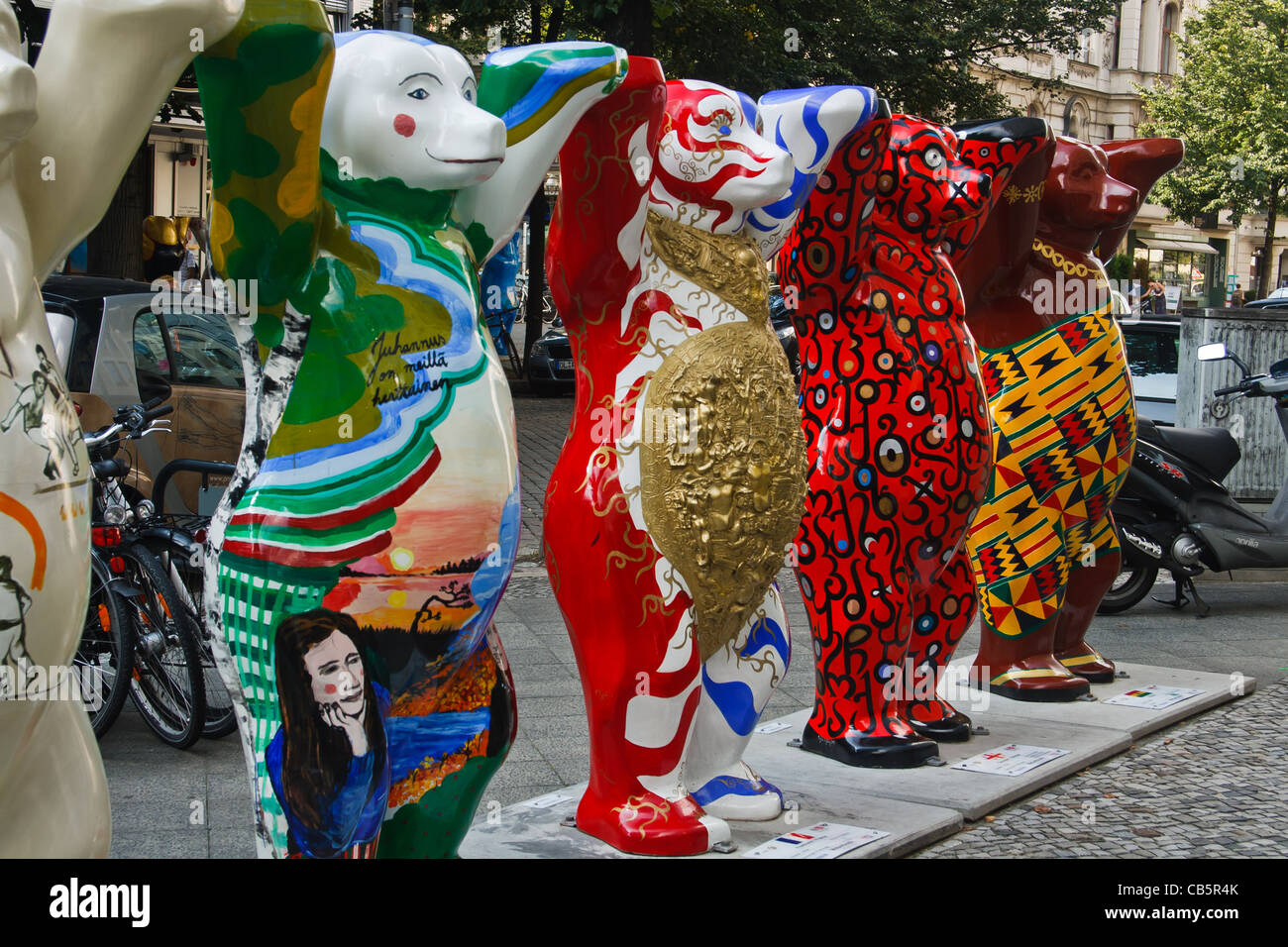 Row of United Buddy Bears - painted life-size fibreglass sculptures on  Kurfurstendamm, Berlin, Germany. Stock Photo