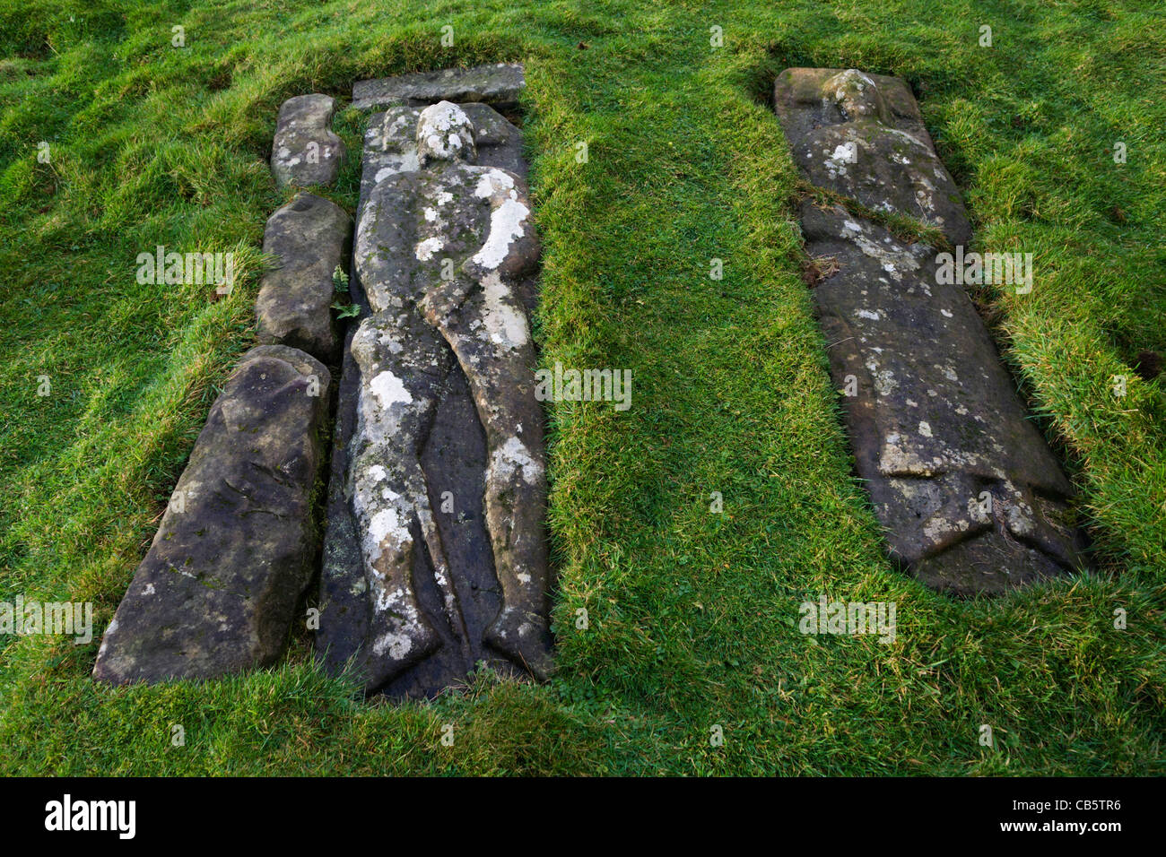 Two 17th century slabs, bearing full-length effigies of a man and woman in Pennygowan Cemetery (Caol Fhaoileann), Salen. Stock Photo