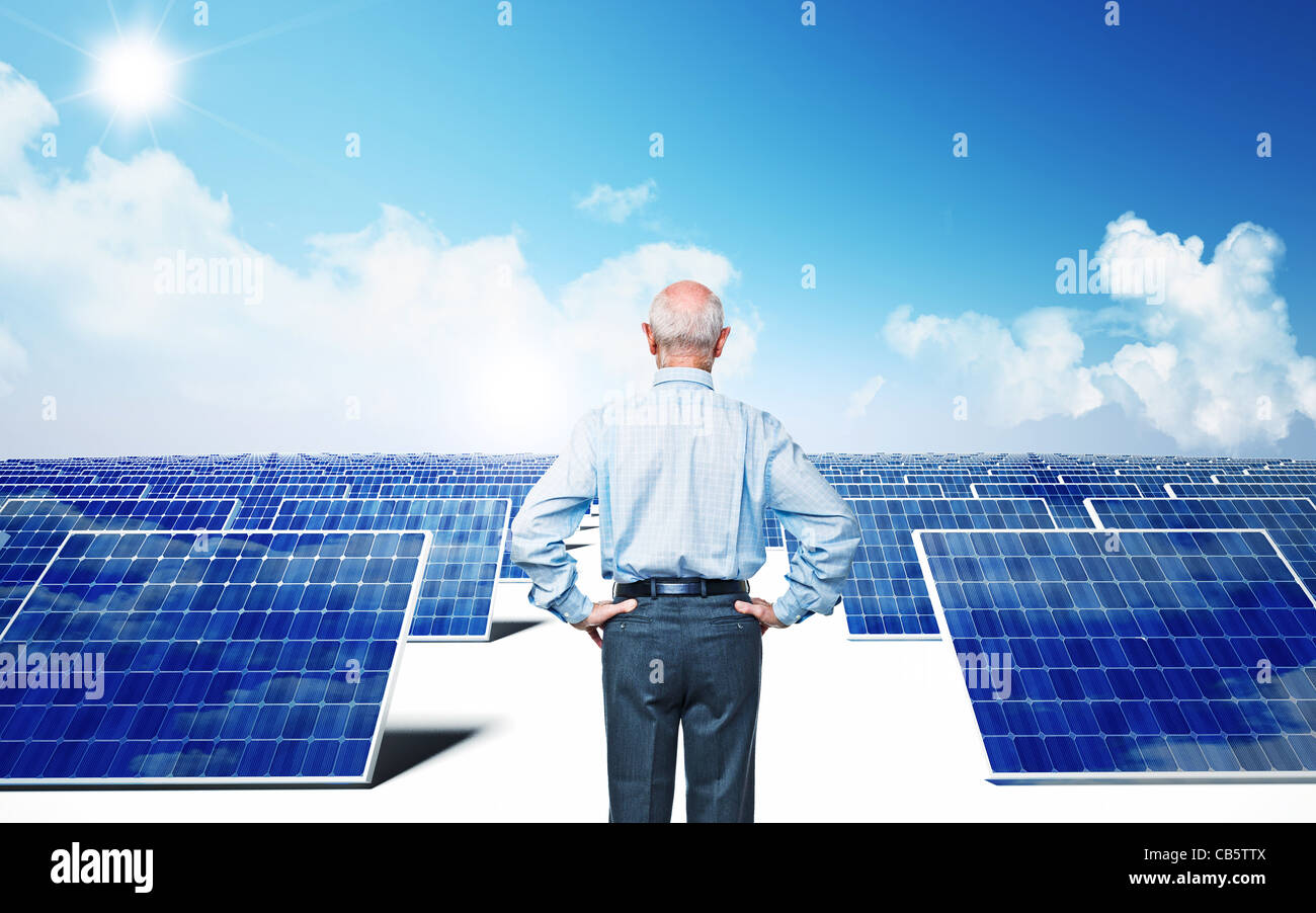old man look solar power station Stock Photo