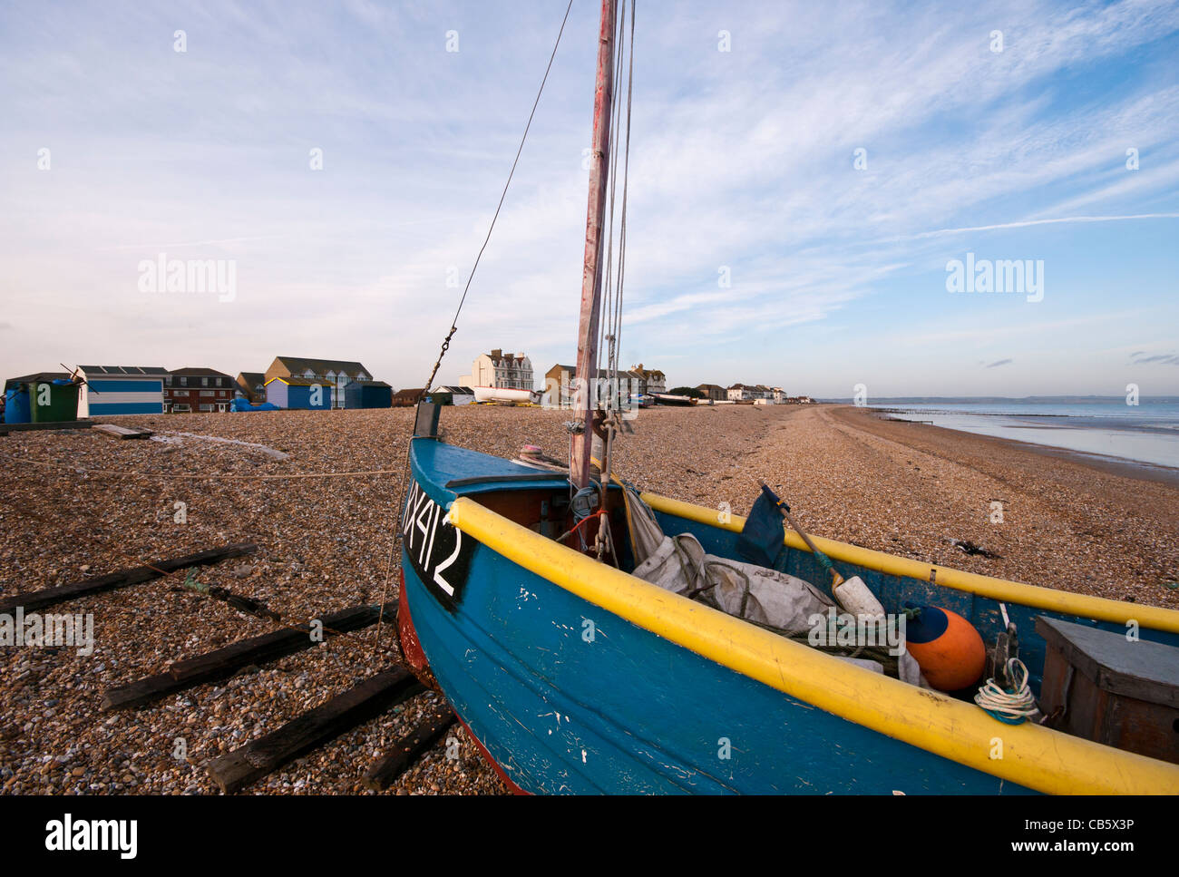 Blue Wooden Fishing Boat On The Beach at Littlestone Kent England UK Stock Photo