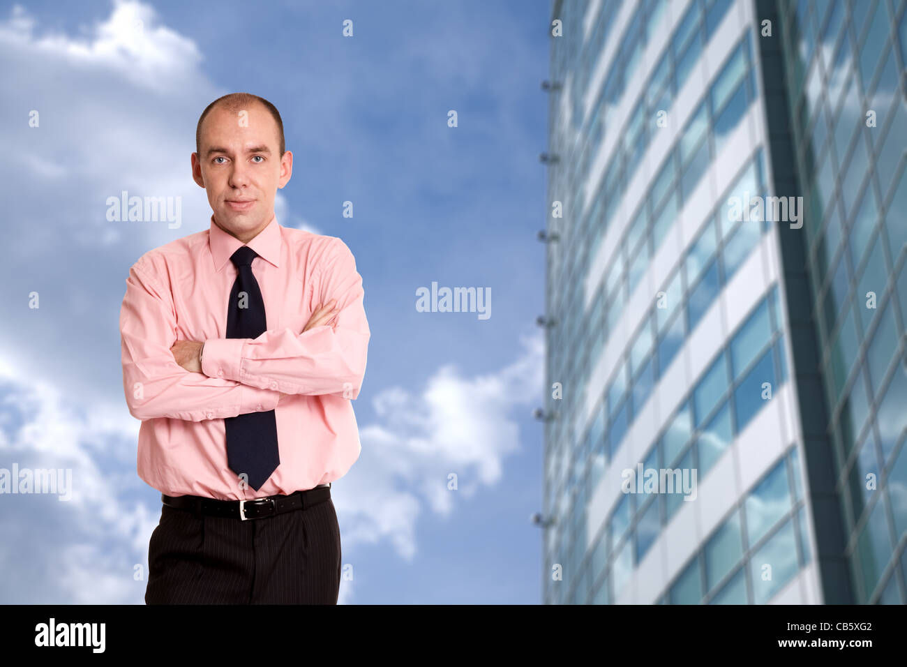 happy businessman outside office building Stock Photo