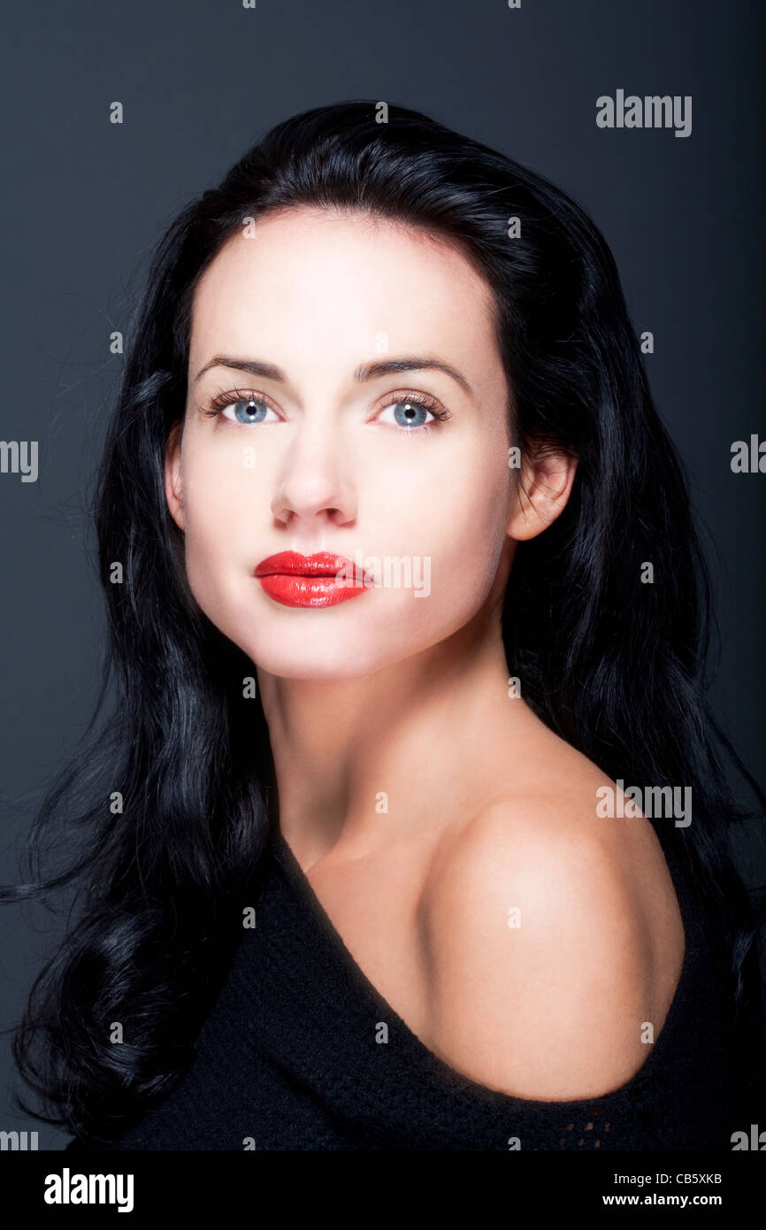 portrait of beautiful woman with dark hair and blue eyes Stock Photo ...