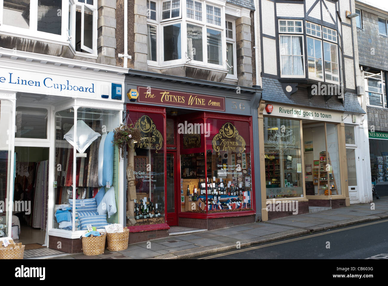 Shops on high street totnes including totnes wine and riverford organics Stock Photo