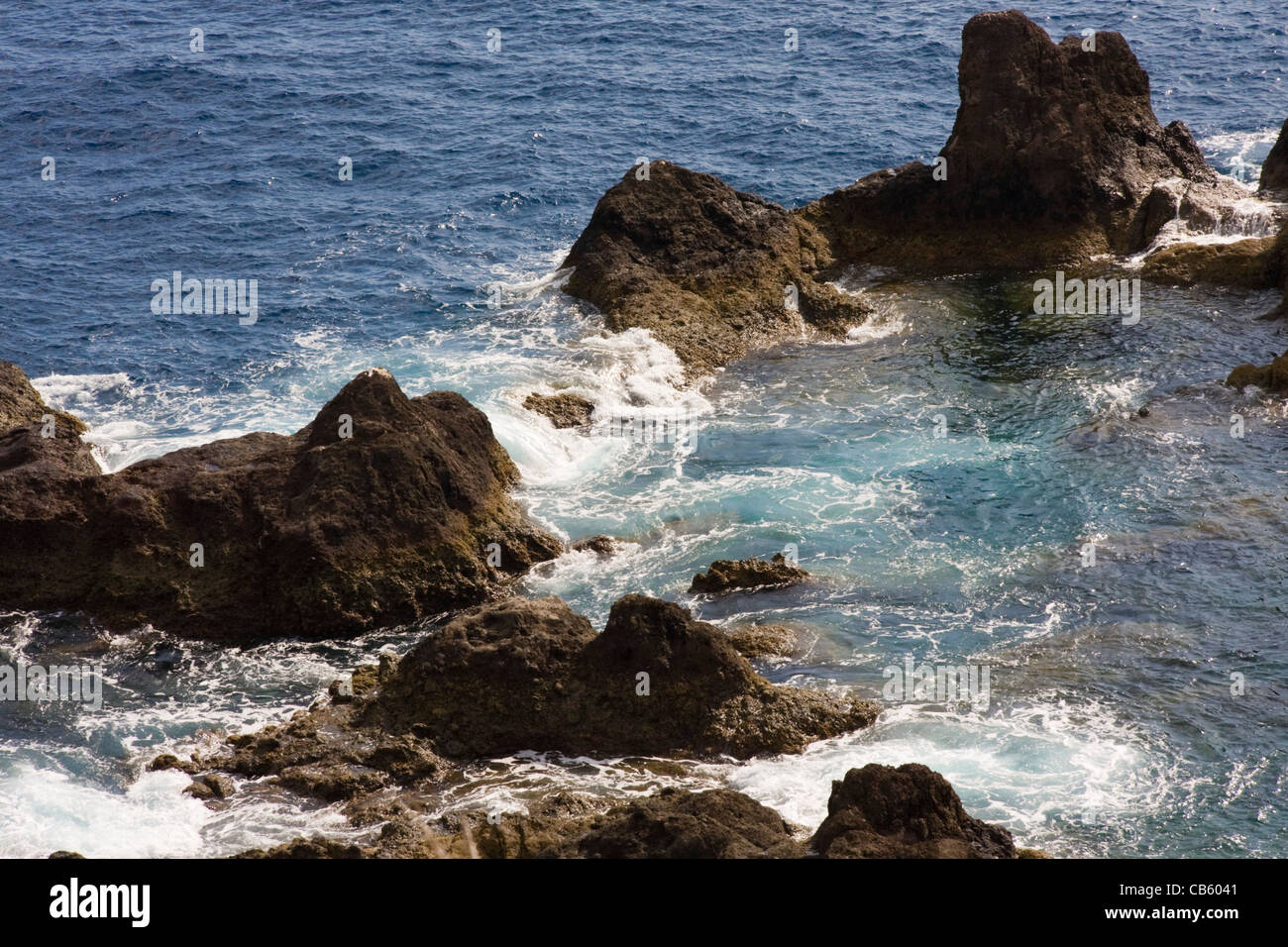 Rough seas and rocks, Ponta da Cruz, near Funchal, Madeira Stock Photo ...