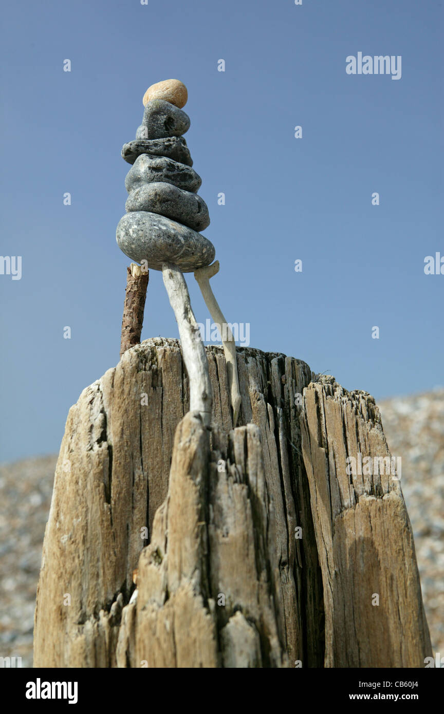 Balanced stone sculpture on the beach at Littlehampton. 2 Stock Photo