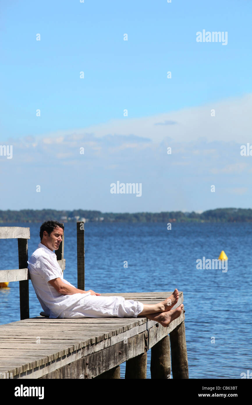Man looking out to sea Stock Photo - Alamy